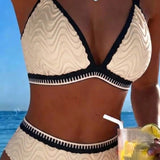 "Divkrāsu teksturēts bikini ar divām siksnām" can be rewritten as "Divkrāsu teksturēts bikini ar divām siksnām" (the title is already clear and descriptive). However, if you're looking for a more engaging option, you could try:

"Divkrāsu teksturēts bikin
